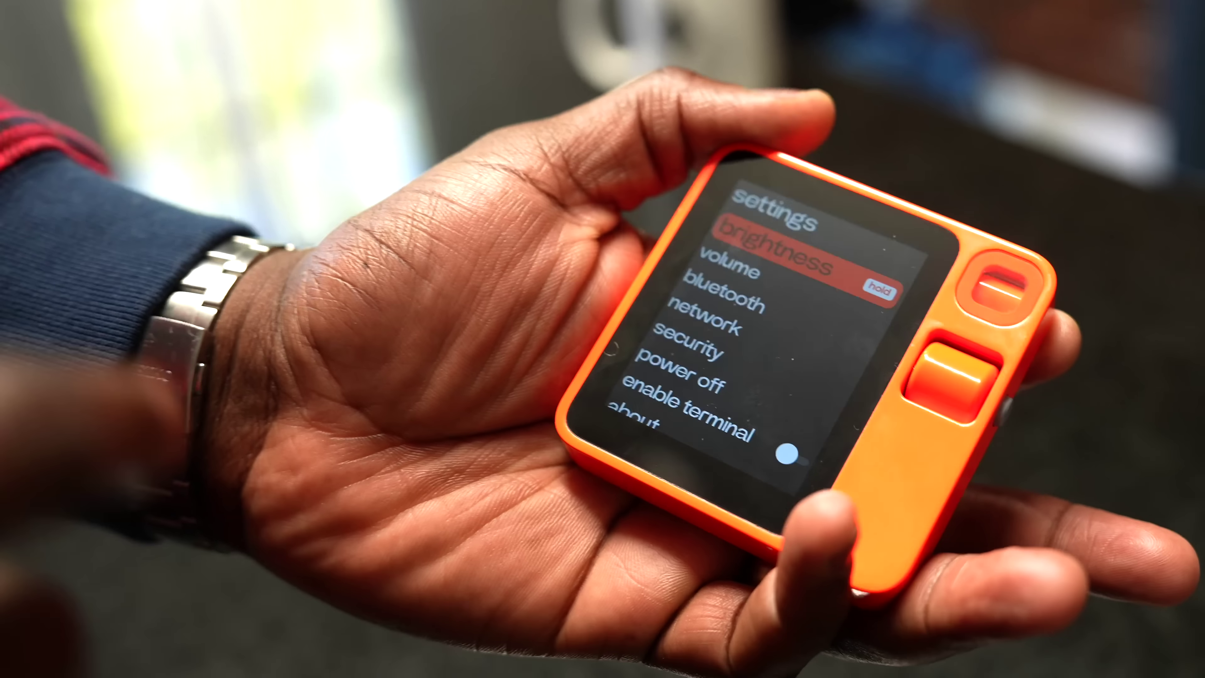 Rabbit R1 — the bright orange AI device that sold 100K units before mass returns hit